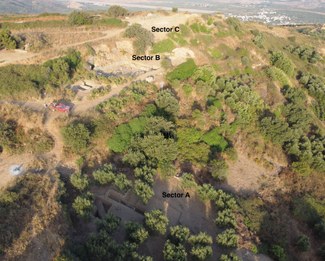 The acropolis of Lyktos with the three excavation sectors marked. The plain in the backgroundis occupied by the town of Kastelli and the runway of the military airport which is being turned into the new international airport of Crete. © Lyktos Archaeological Project.