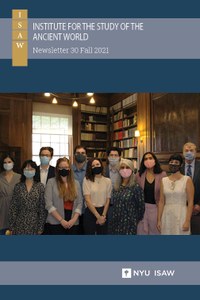 Newsletter cover featuring new students. Wearing masks over their mouths and noses, they stand shoulder-to-shoulder in a group in a wood-paneled room with bookcases and a large window behind them.